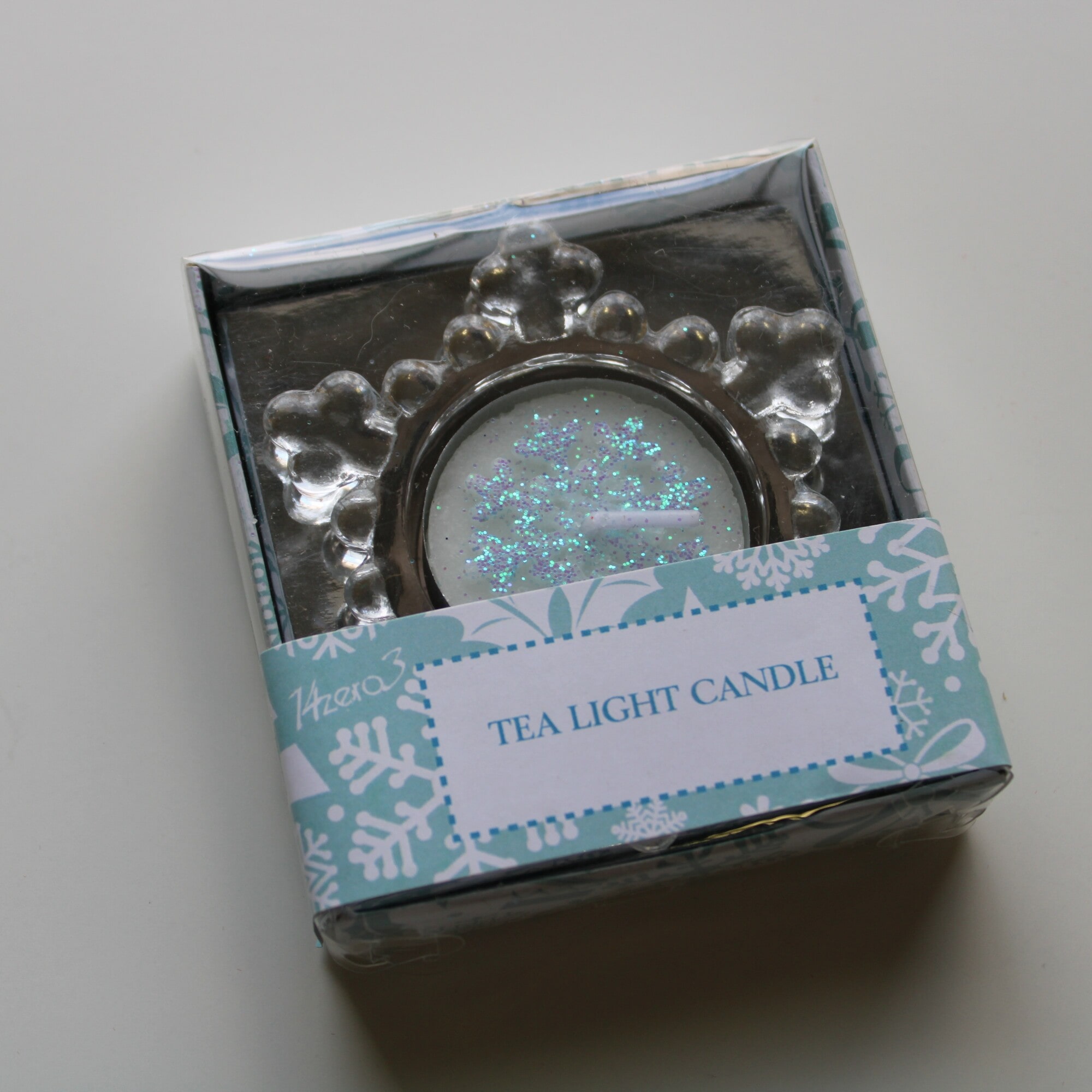 Porta tea light in vetro a forma di fiocco di neve Ø 7 cm. con candela lumino glitter rosa-775