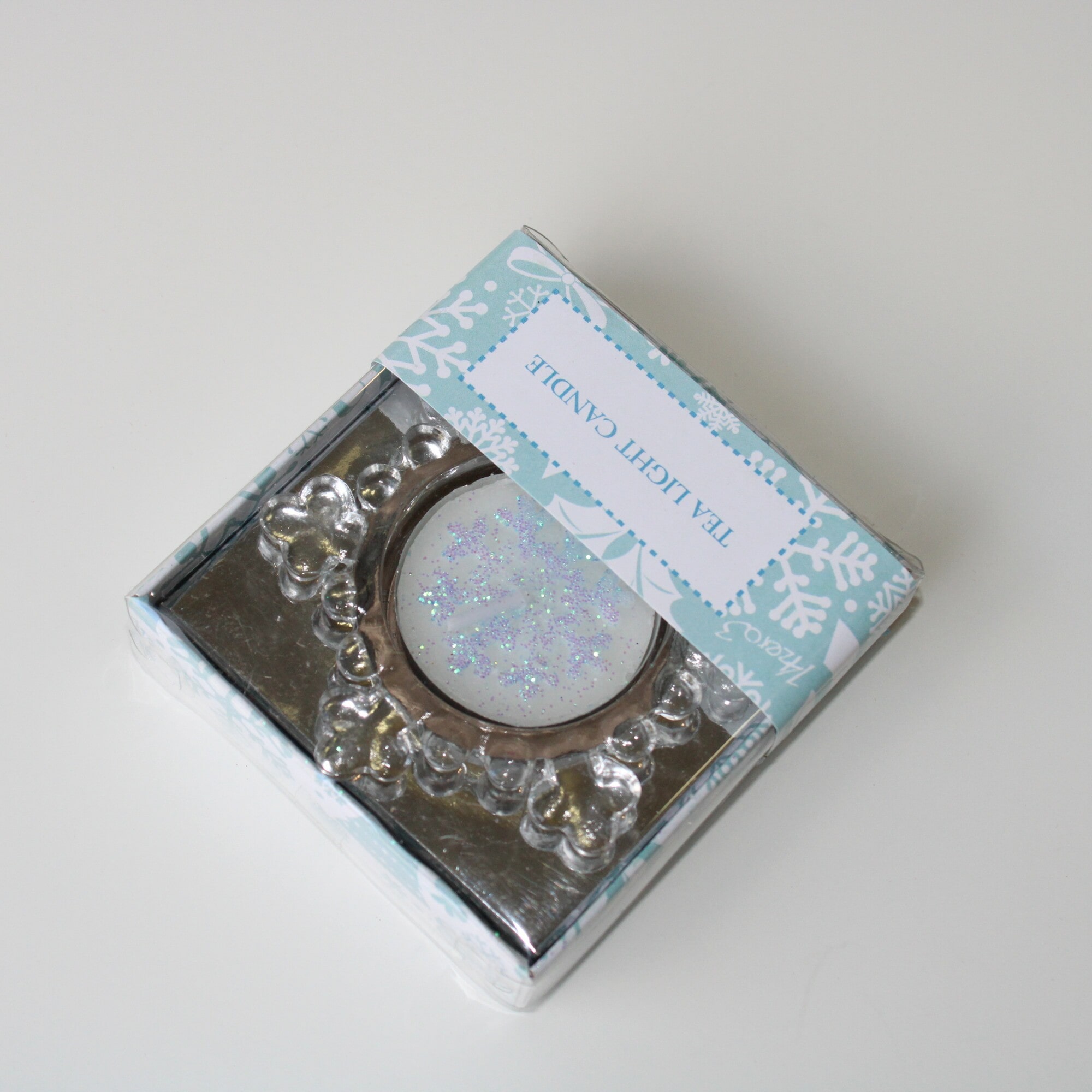 Porta tea light in vetro a forma di fiocco di neve Ø 7 cm. con candela lumino glitter rosa-777