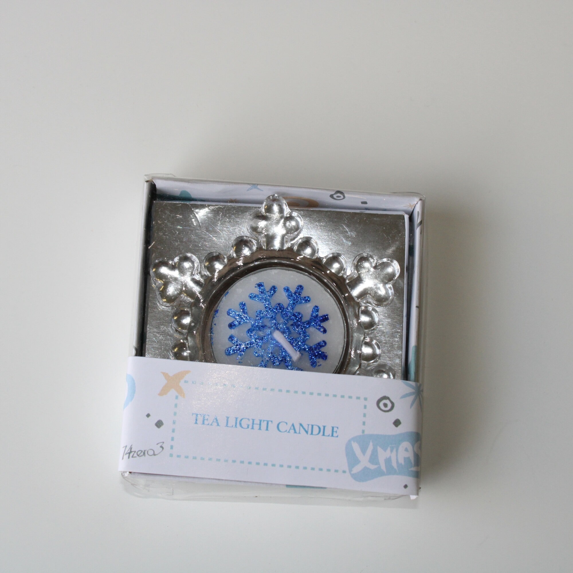Porta tea light in vetro a forma di fiocco di neve Ø 7 cm. con candela lumino glitter blu-783